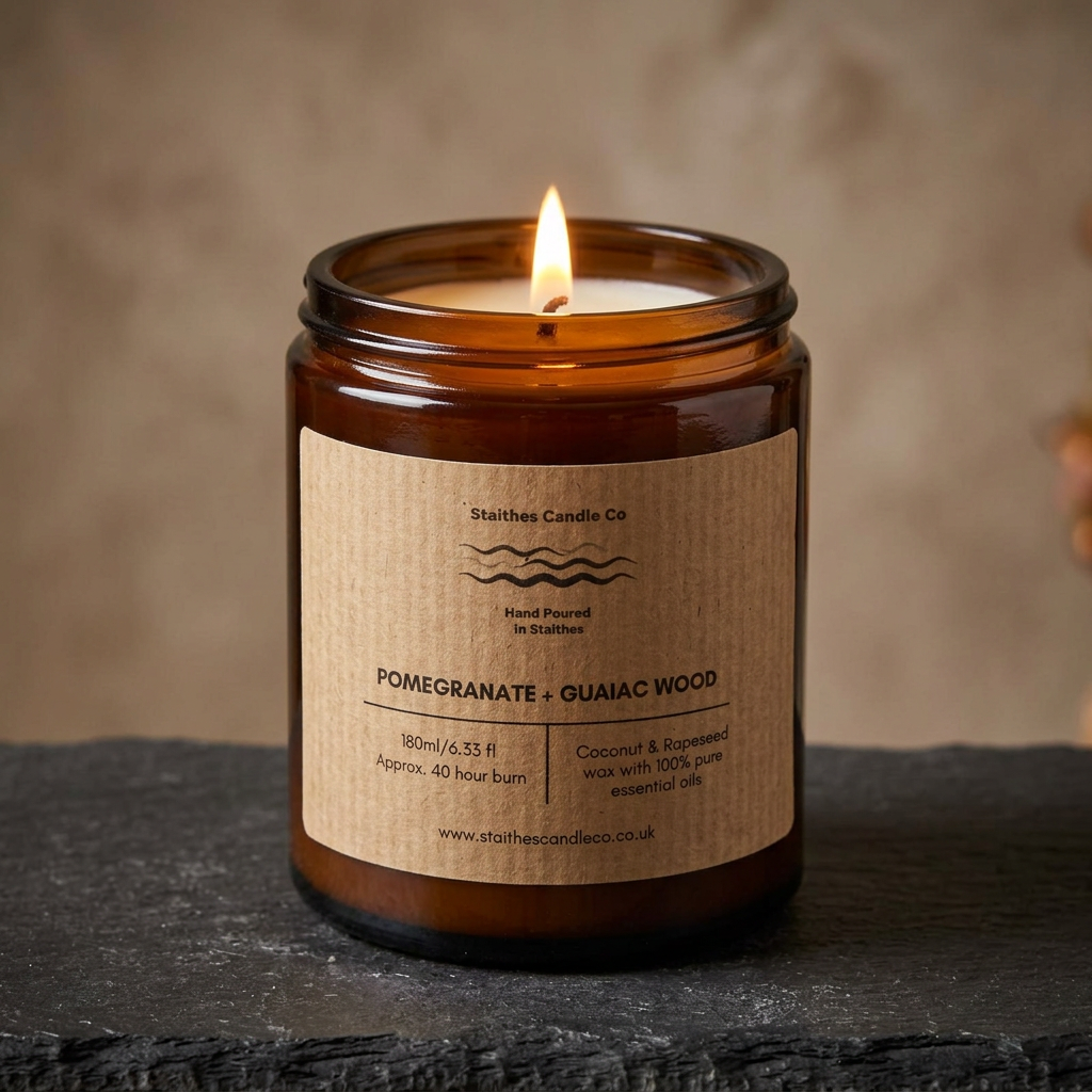 Warm lit Pomegranate & Guaiac Wood candle