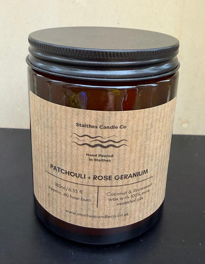 patchouli & rose geranium candle amber glass jar with black aluminium lid 