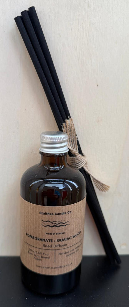 Pomegranate & Guaiac wood  amber glass diffuser bottle with reeds with a brown label