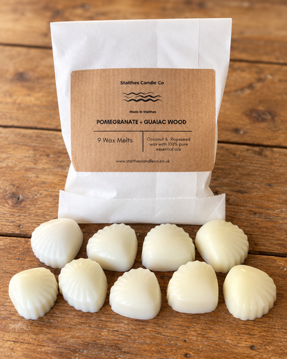 A white paper bag of Stalthes Candle Co. Pomegranate + Guaiac Wood scented wax melts 