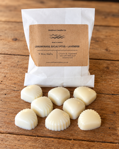 A white paper bag labeled 'Staithes Candle Co' with a kraft paper front panel reading 'LEMONGRASS, EUCALYPTUS - LAVENDER' and '9 Wax Melts