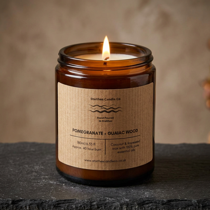 Warm lit Pomegranate & Guaiac Wood candle